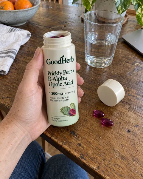 GoodHerb customer holding the bottle